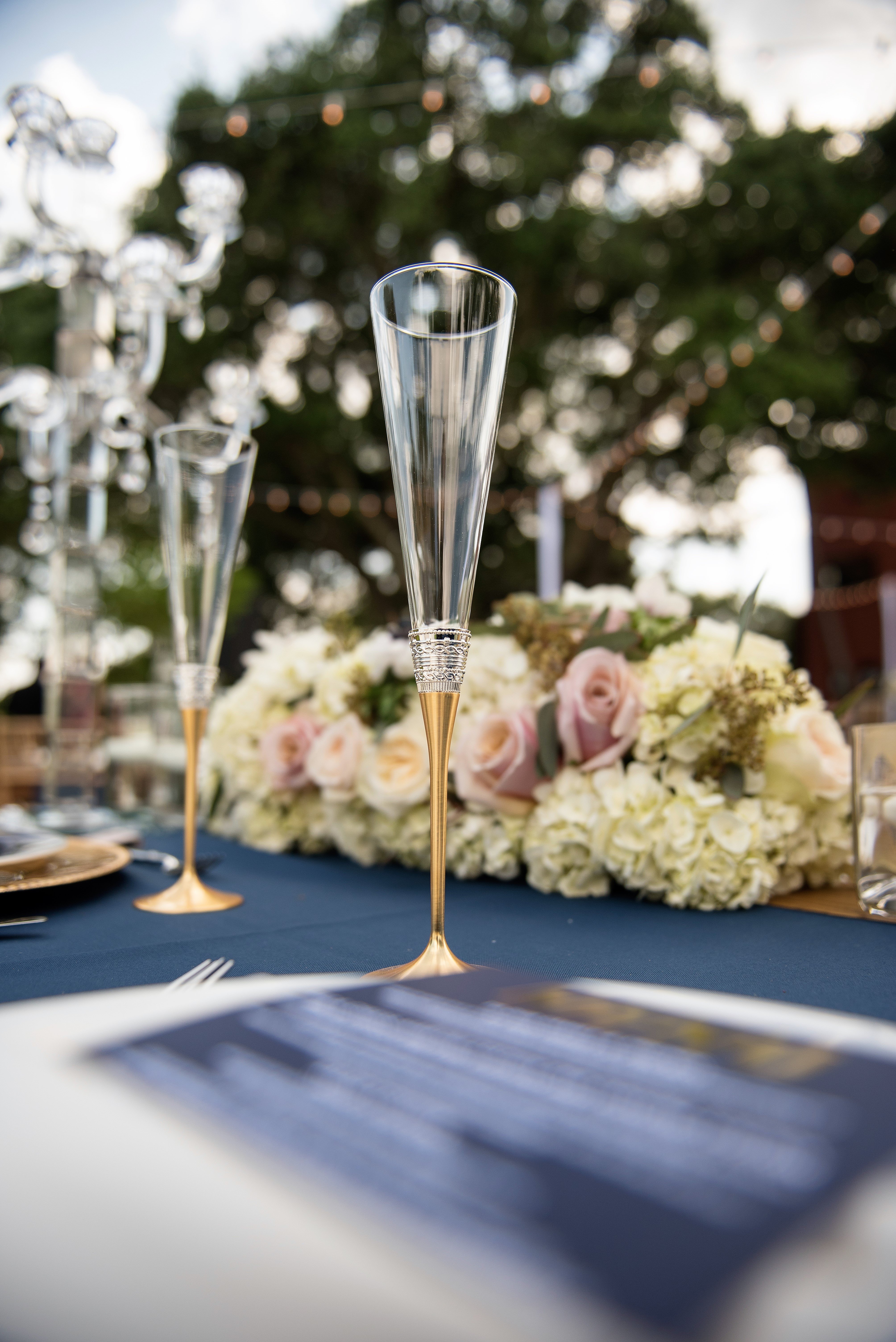 Miami wedding caterer at Thalatta Estate | Eggwhites Catering wedding | Wedding place settings include elegant champagne flutes for wedding toast