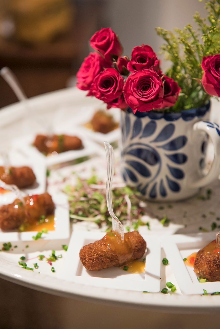 Spanish Ham Croquettes with Papaya Salad on a stoneware platter at the Pottery Barn South Beach Grand Opening event