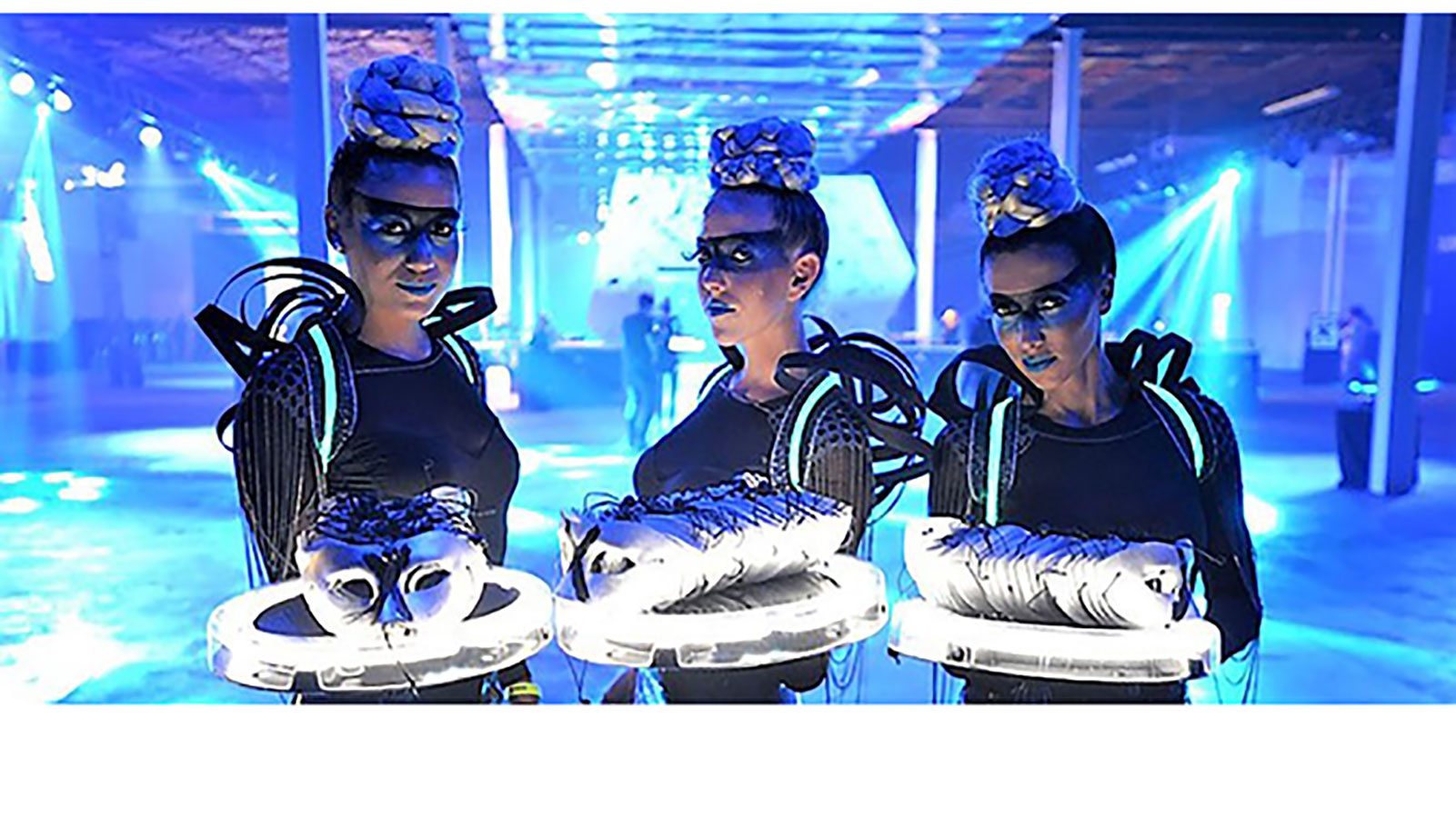 Absolut X girls pass out masks at this masquerade ball at Soho Studios in the Wynwood Arts District