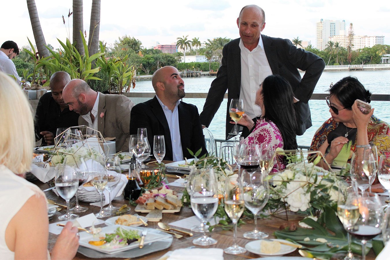 Dinner guests with architect Piero Lissoni at a Ritz Residences Miami Beach dinner