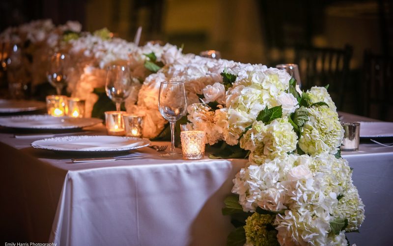 Classic and romantic all-white wedding flowers for a royal table