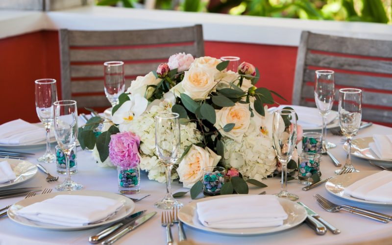 Lovely spring wedding centerpiece of pale roses, peonies, hydrangea and orchids