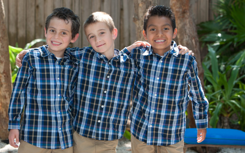 Matching plaid and khakis for the ringbearers at this casual beach wedding