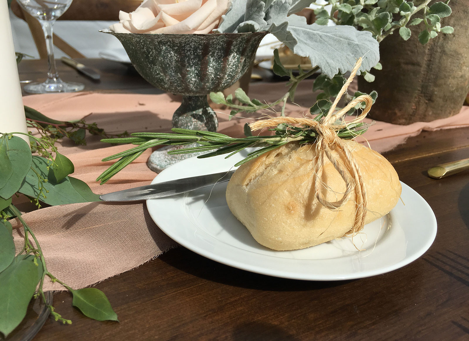 Dinner roll wrapped with rosemary and twine at Miami Seaquarium green wedding