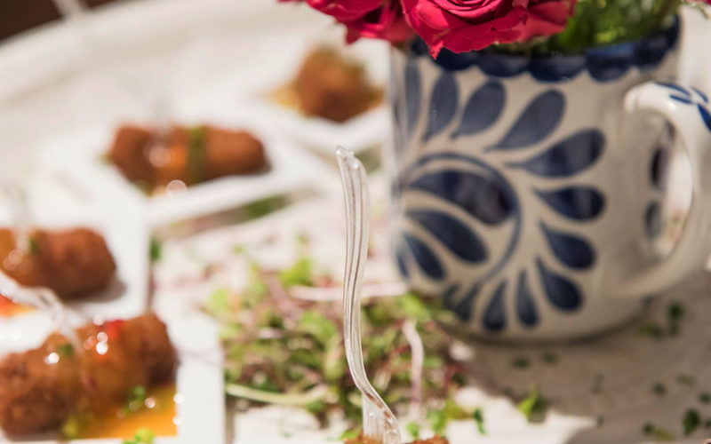 Spanish Ham Croquettes with Papaya Salad on a stoneware platter at the Pottery Barn South Beach Grand Opening event