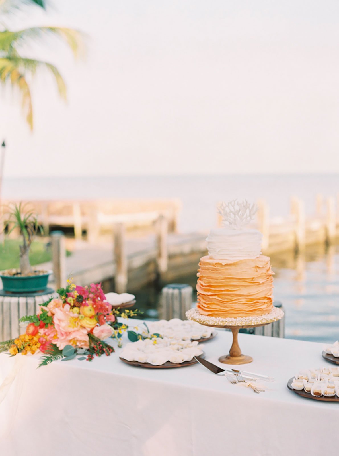Orange and White Ombre Wedding Cake with Ruffled Fondant and Guava Cheesecake Filling