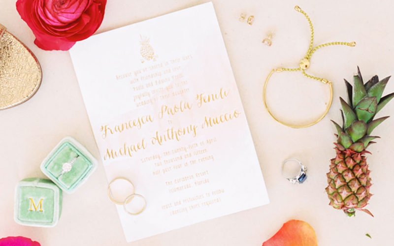 Custom gold wedding invitation with pineapple motif accent