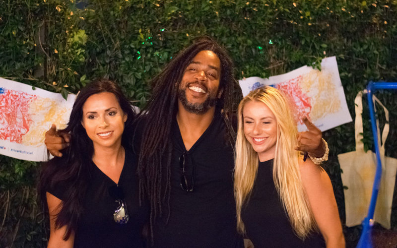 Artist Ruben Ubiera with the Ink Wells team at the Southwest #Heartoftravel event in the FATVillage Arts District