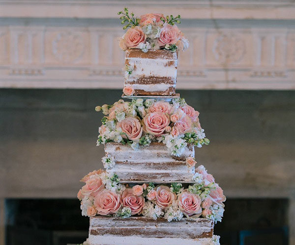 Stunning naked wedding cake on antique silver stand at Wendy and Marc's Deering Estate wedding | Wedding cake by Susie's Scrumptious Sweets