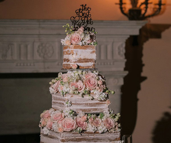 Stunning naked wedding cake on antique silver stand at Wendy and Marc's Deering Estate wedding | Wedding cake by Susie's Scrumptious Sweets