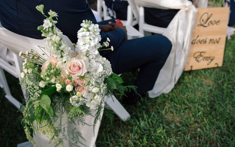 Pale pink roses, White Larkspur and Queen Anne's Lace aisle flower decor at Deering Estate wedding in Miami