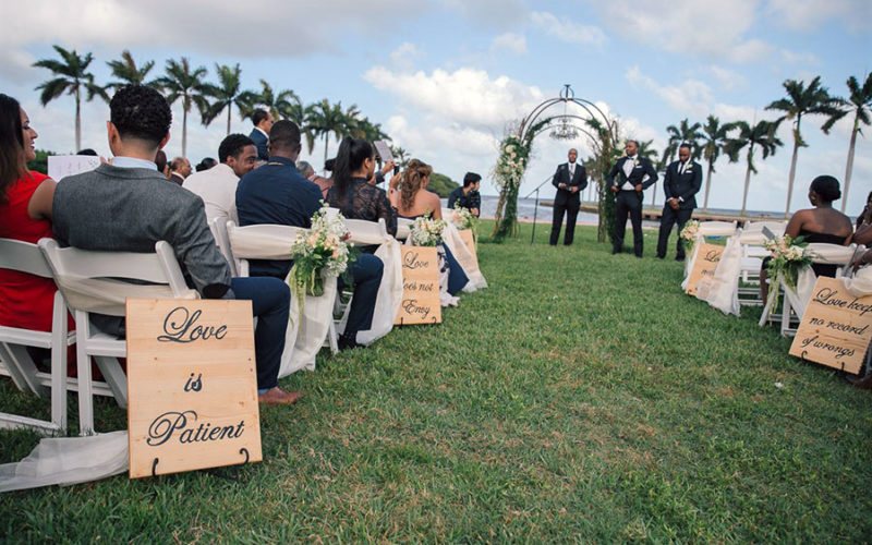 Wooden wedding aisle signs at Wendy and Marc's Deering Estate wedding