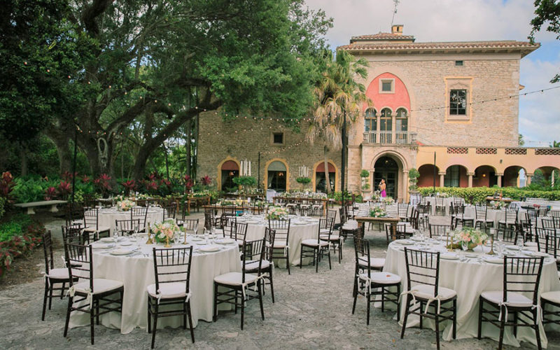 Dinner reception set up in the courtyard for this Deering Estate wedding