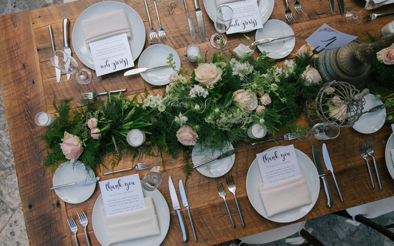 Wild table runner with greenery, queen anne's lace and pale pink roses at this Deering Estate wedding