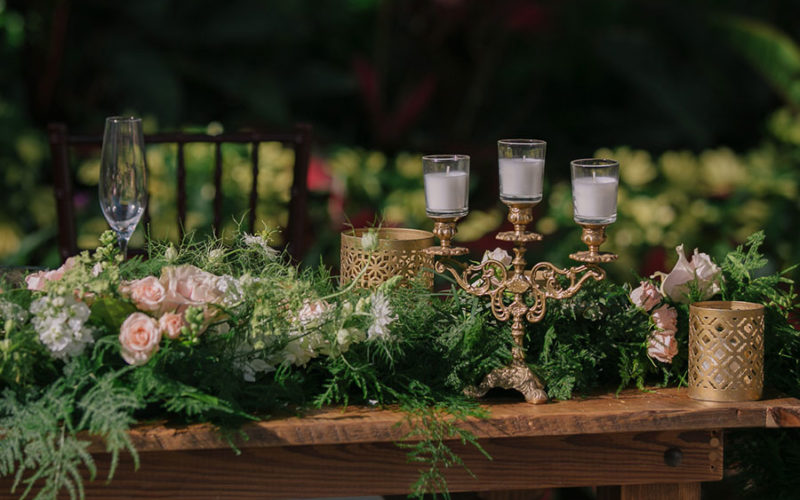 Sweetheart table decor and floral detail at Deering Estate wedding