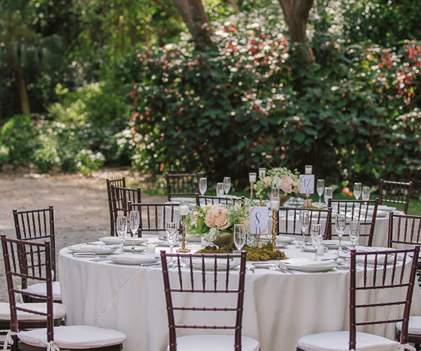 Dinner reception set up in the courtyard for this Deering Estate wedding