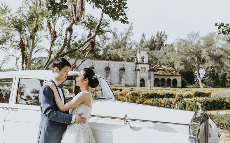 Wedding venues in Miami | Ancient Spanish Monastery wedding | Bride and groom in front of vintage car