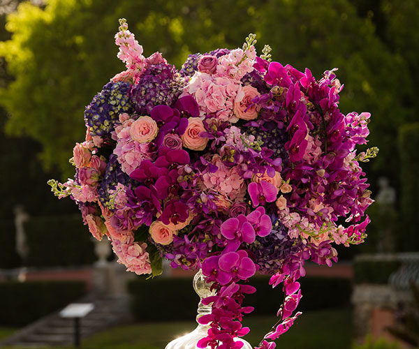 Wedding Ceremony Décor | Stunning floral pedestals in shades of pastel pink, fuschia, magenta and deeper tones of ultra violet at this romantic Vizcaya wedding