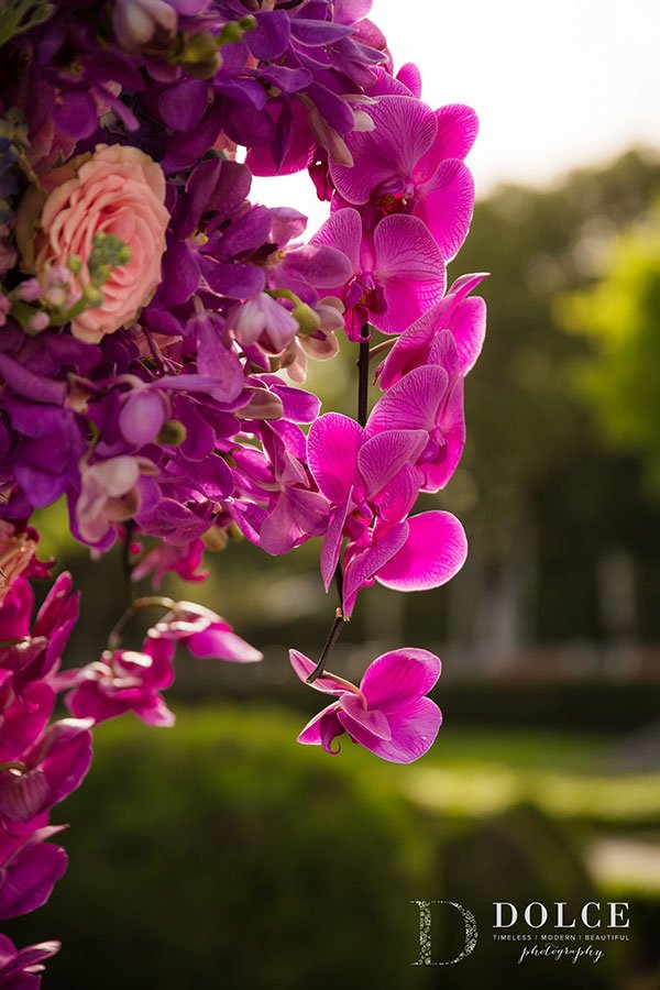 Wedding Ceremony Décor | Stunning floral pedestals in shades of pastel pink, fuschia, magenta and deeper tones of ultra violet at this romantic Vizcaya wedding