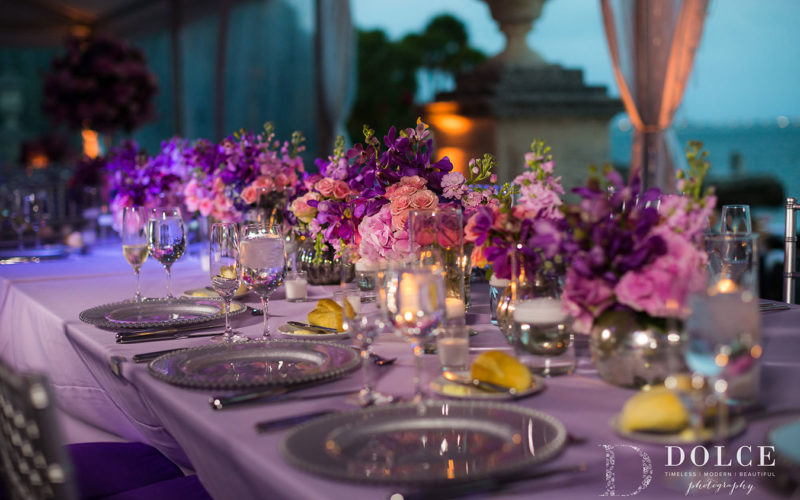 2018 Wedding Colors | Ultra Violet |Floral table runner of romantic pink, purple and ultra violet floral centerpieces in small mercury glass vases