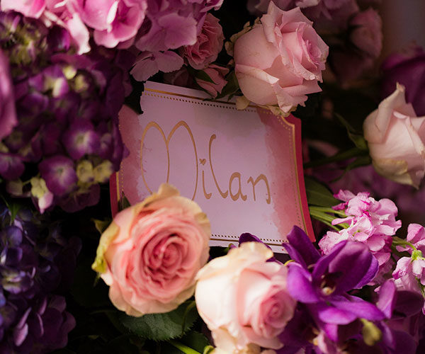 2018 Wedding Colors | Table signs were nestled in vibrant pink, purple and ultra violet flowers. Table names were all locations special to the couple.