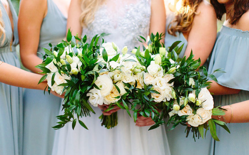 Simple, natural and classic white and green bridal bouquet with ranunculus, garden roses, peonies and foliage