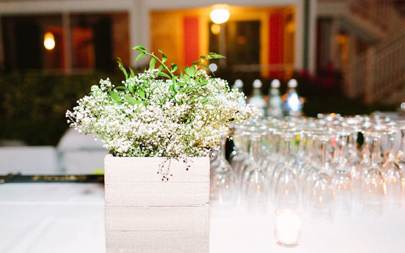 Bar floral centerpiece champagne glasses | Deering Estate wedding in Miami