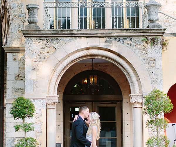 Kim and Michael enjoy a moment in front of the entrance to Deering Estate in Miami