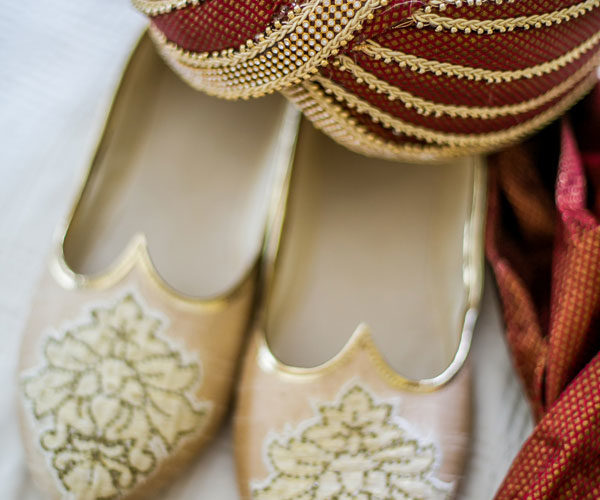 The wedding turban (safa) and Mojari shoes complete the groom's traditional wedding outfit