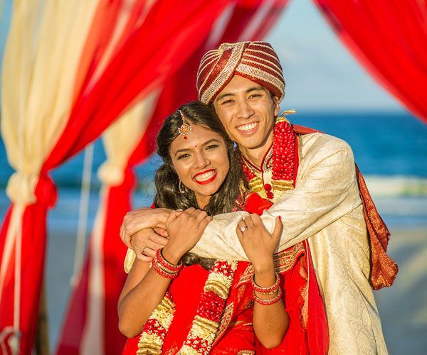 Radiant couple after their Indian wedding ceremony at Wright by the Sea