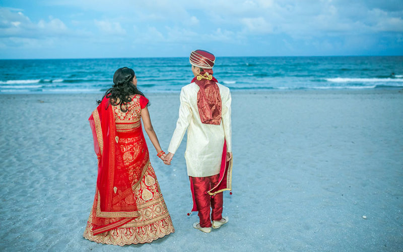 Couple enjoy a moment on the beach after their beach wedding ceremony | Wright by the Sea