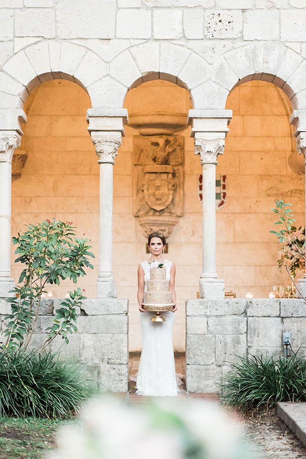 Bride with cake | Ancient Spanish Monastery cloisters