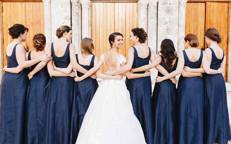 bridesmaids pose in front of church | Beautiful churches in Miami for wedding