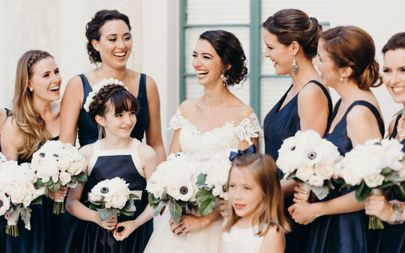 bridesmaids pose in front of church | Beautiful churches in Miami for wedding