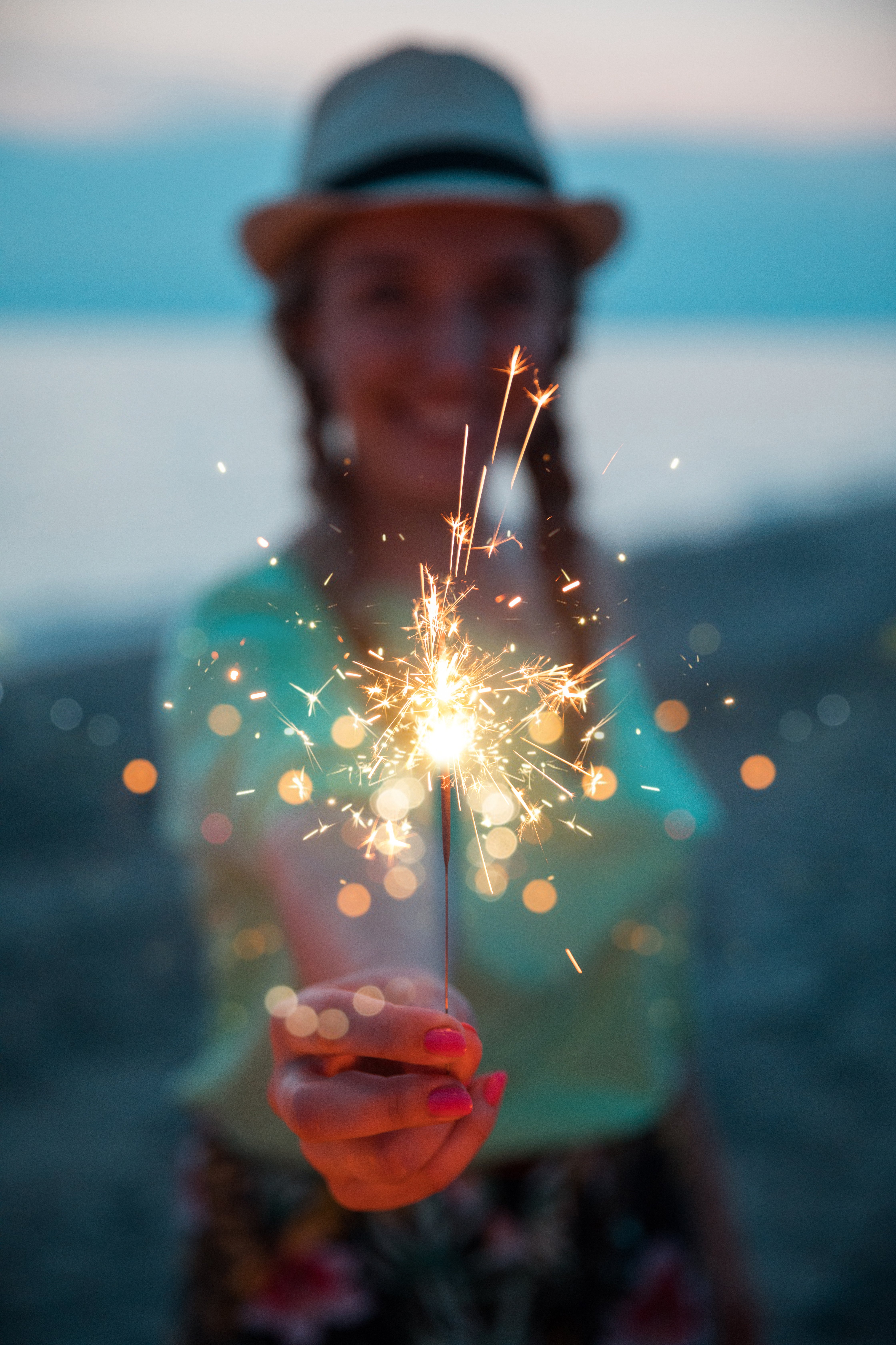 post-wedding day beach party | guest with sparkler