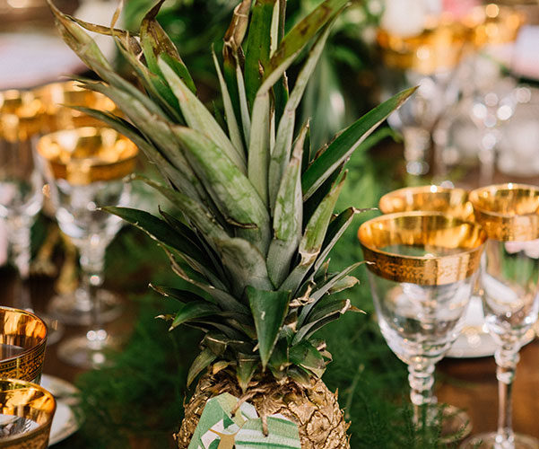 tropical theme wedding | gold pineapple table numbers