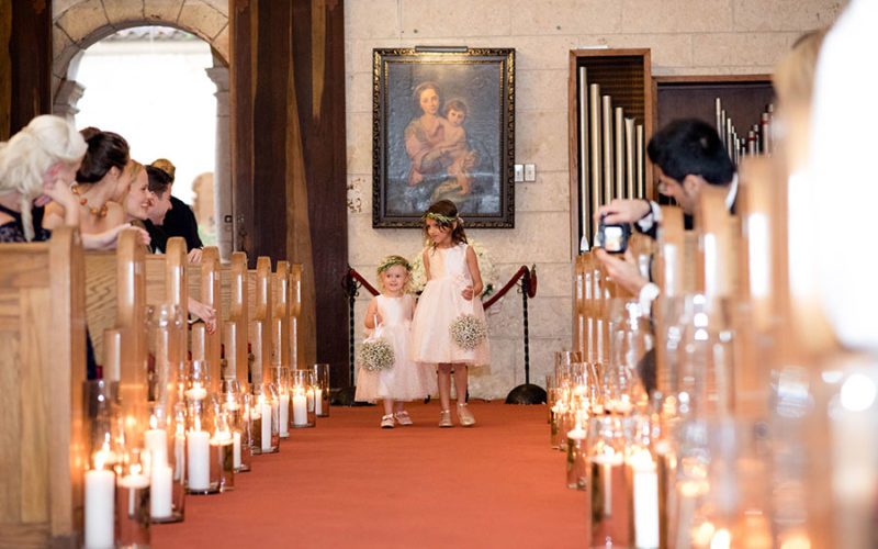 flower girls at ancient spanish monastery wedding ceremony